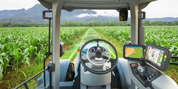 Máquina na lavoura sendo monitorada através de recursos da agricultura digital
